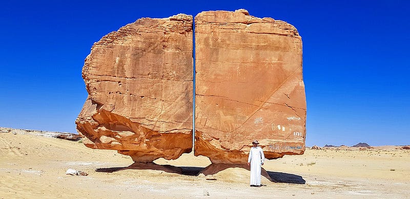 Al Naslaa rock formation showcasing its unique split