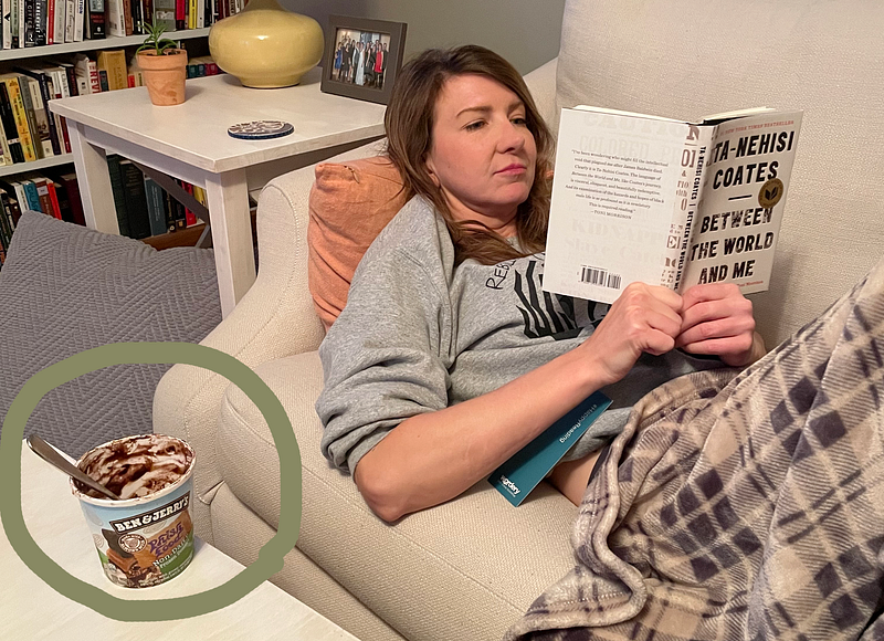 Author enjoying a book after finishing off some Ben & Jerry’s ice cream.