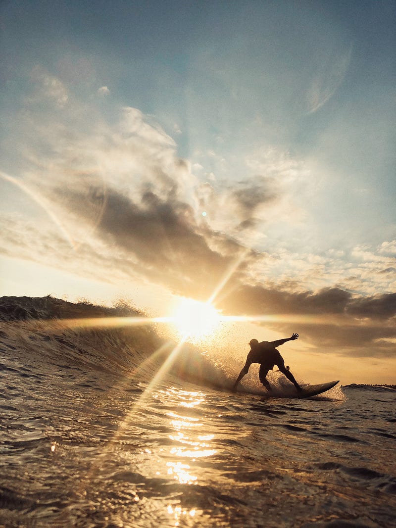 Surfboard gliding over waves, representing soul connection