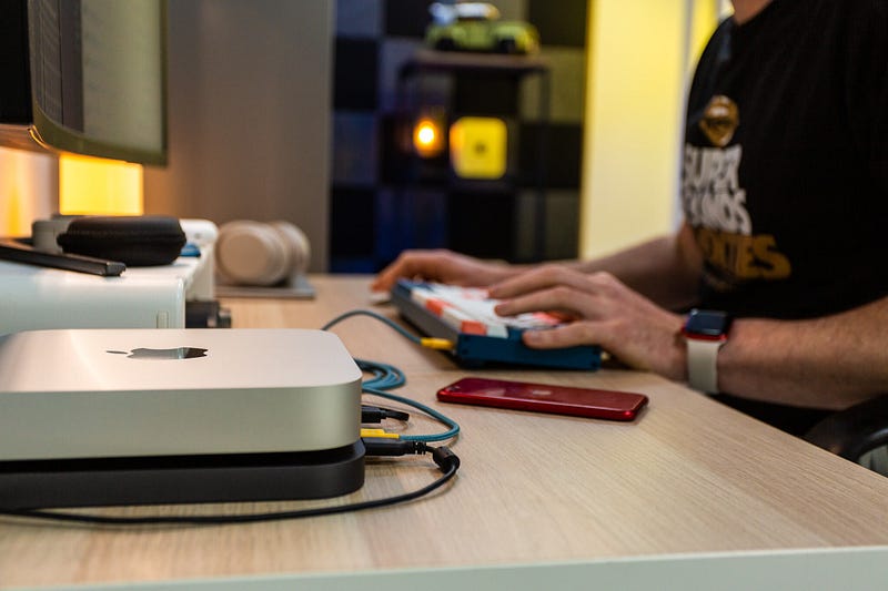 M1 Mac mini on a stylish desk in a studio setting