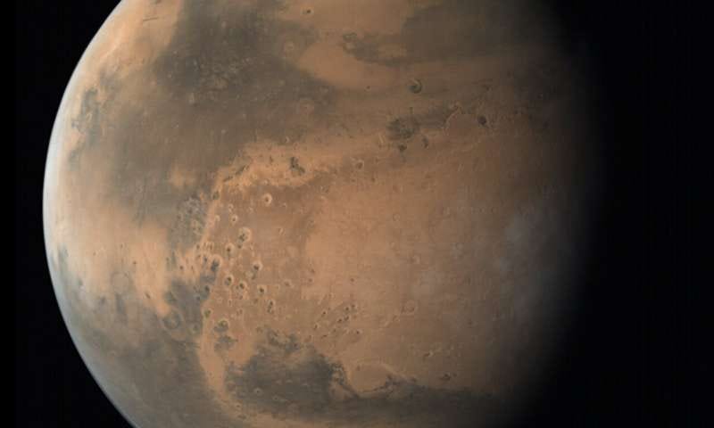 Aerial view of Mars’ northern polar ice cap showcasing ancient ice.