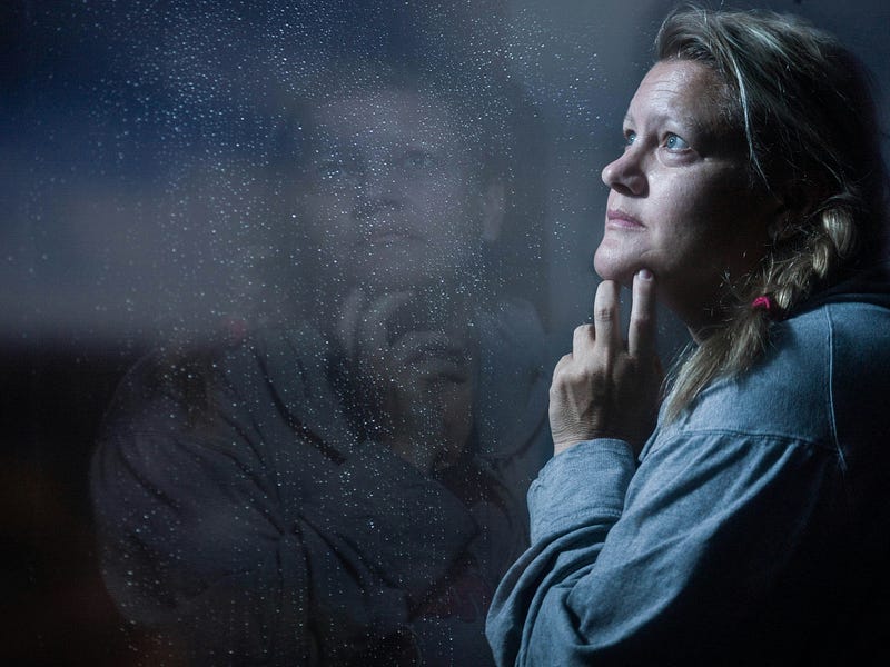 Tranquil rain scene outside a window