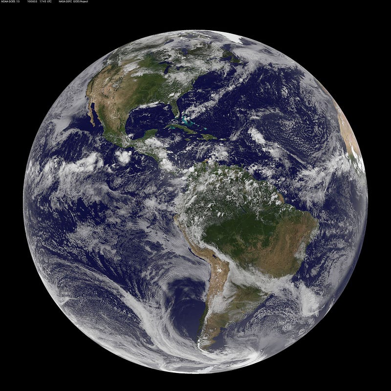 Earth as seen from the GOES-13 satellite, appearing nearly spherical.